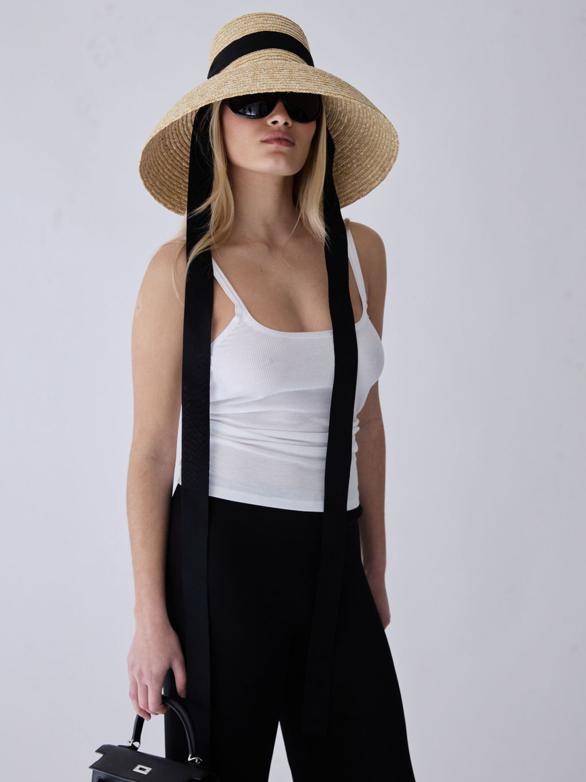 Cassia Silk Trousers high-waisted black silk trousers with wide-leg silhouette and clean front finish.