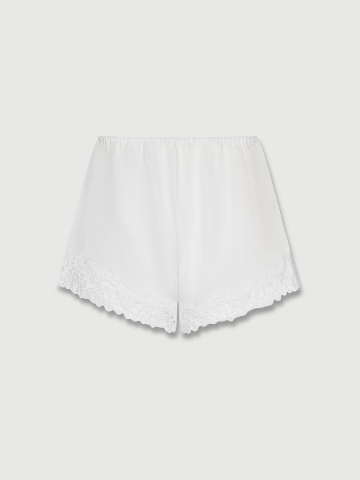 Luna White Linen Lace Shorts with scalloped floral lace hem and elasticated waistband, flat lay.