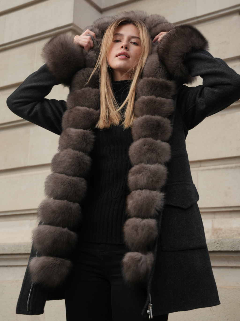 Women’s dark grey merino wool coat by L.CUPPINI with removable fox fur vest lining and fur-trimmed hood