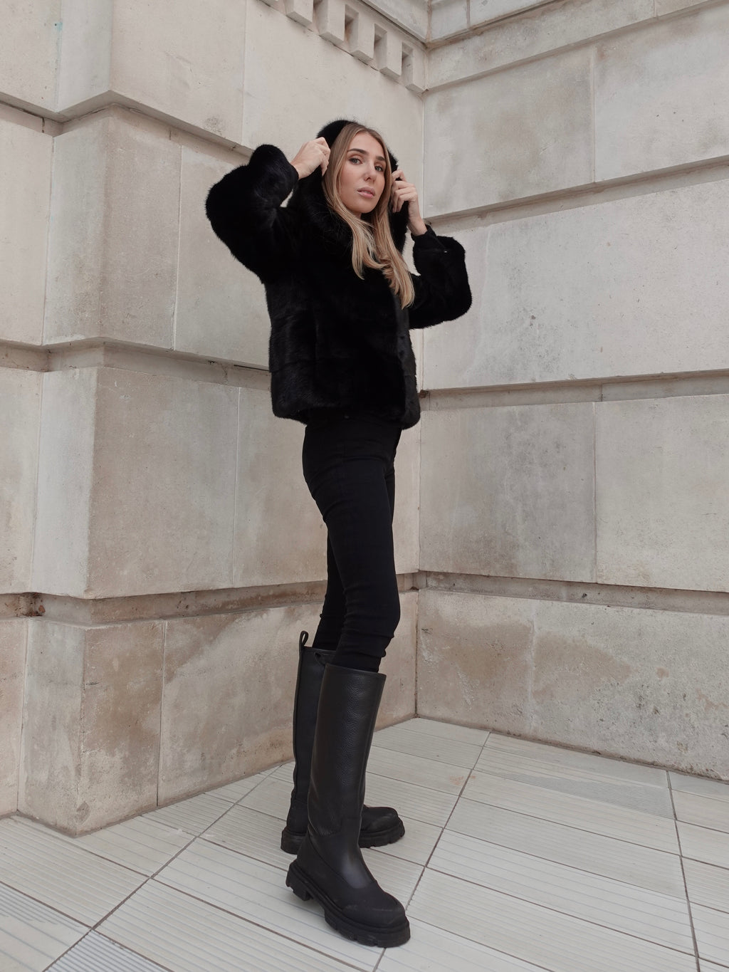 The Alexandra black mink fur coat by L.CUPPINI styled as an elegant luxury winter outerwear piece